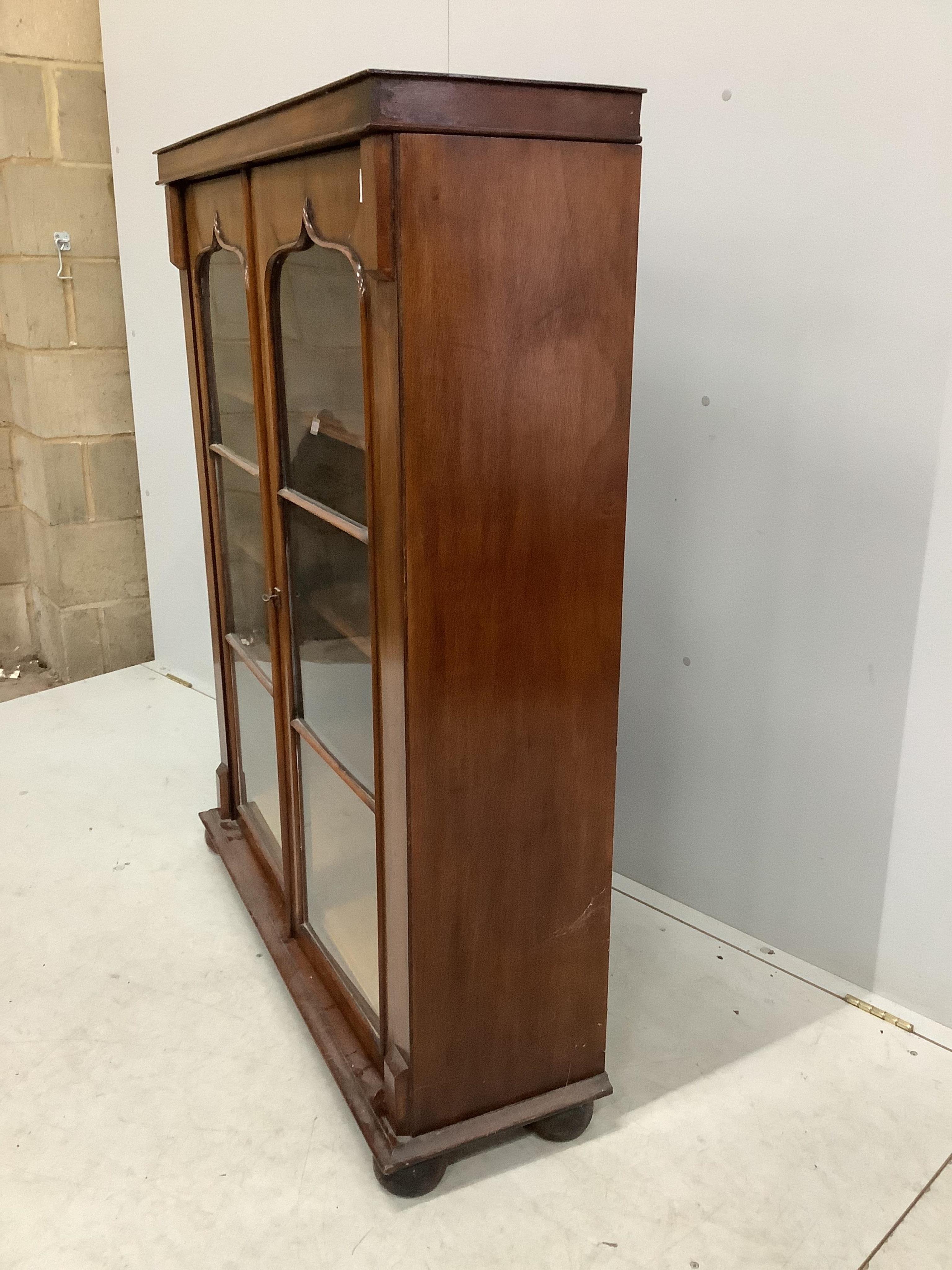 An early Victorian mahogany bookcase, (adapted), width 100cm, depth 30cm, height 127cm. Condition - fair